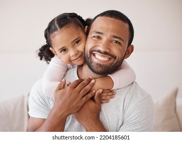 Children, family and love with a girl and her father hugging, embracing and bonding together in their home. Kids, smile and happy with a man and his daughter enjoying time with a loving expression - Powered by Shutterstock