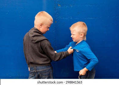 children fight between two angry aggressive brothers (kids, boys)