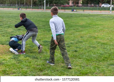 Children Fight. Conflict Of Teens On The Playground.