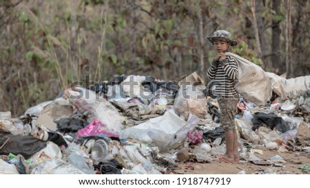  Children find junk for sale and recycle them in landfills, the lives and lifestyles of the poor, Child labor, Poverty and Environment Concepts