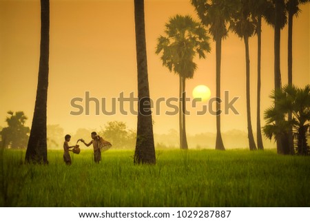 Children fisherman are fishing in the field.