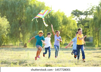 Children flying kite on summer day