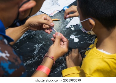 Children Fold Paper In The Shape Of A Plane.