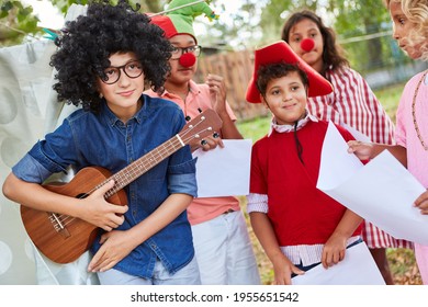 Children In Funny Costumes At The Talent Show At The Holiday Camp Or At The Carnival