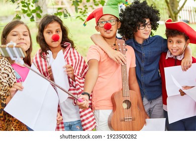 Children In Funny Disguise At A Talent Show At The Holiday Camp Or At Mardi Gras