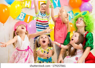 children group with clown celebrating  birthday party
