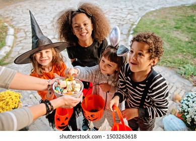 Children in Halloween costumes, trick or treating  - Powered by Shutterstock