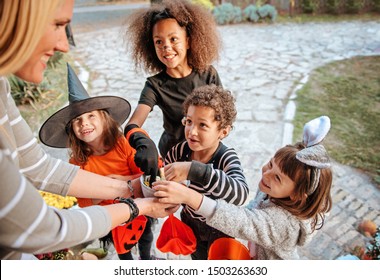 Children in Halloween costumes, trick or treating  - Powered by Shutterstock