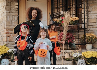 Children in Halloween costumes, trick or treating  - Powered by Shutterstock