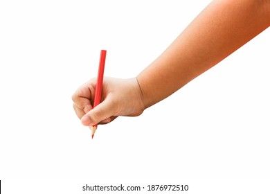 Children Hand Holding A Red Pencil On A Isolated Background.