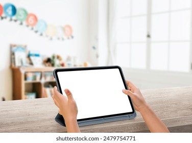 Children Hand Holding tablet with blank screen. Digital learning generation. Watching playing video game. Kids activity with internet in study room. - Powered by Shutterstock