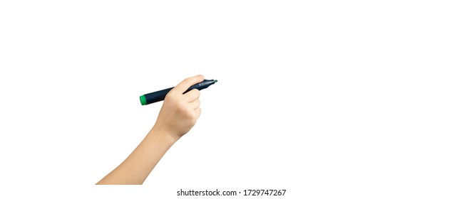Children hand with marker write on an isolated white background. Writing hand. Hand holding black Pen. Wide image.