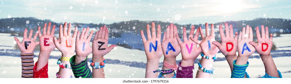 Children Hands Building Feliz Navidad Means Merry Christmas, Winter Background - Powered by Shutterstock