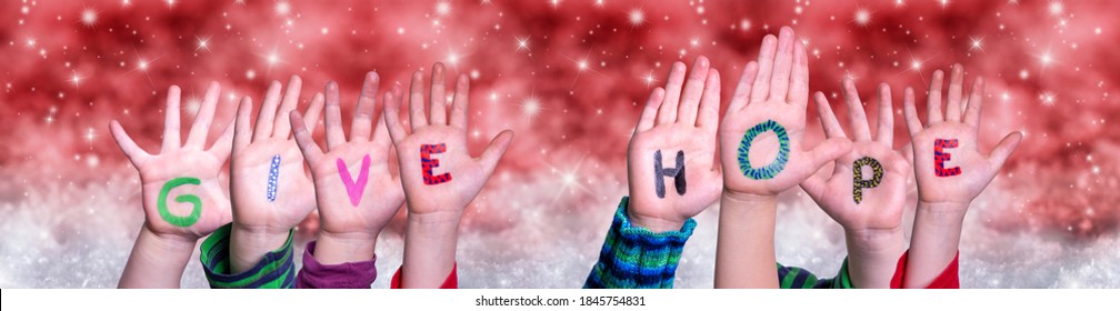 Children Hands Building Word Give Hope, Red Christmas Background