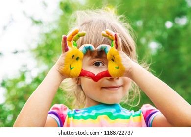 children hands in colors. Summer photo. Selective focus. nature - Shutterstock ID 1188722737