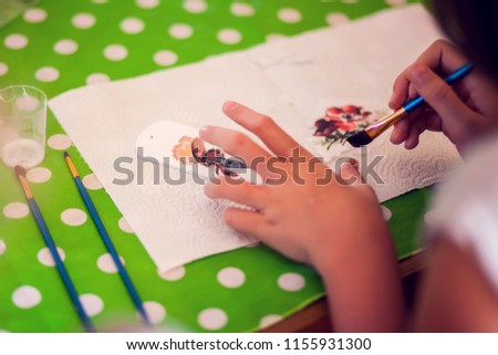 Children hands making artworks with wood and paint crafts. workplace and handcraft Decoupage