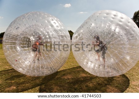 children have a lot of fun in the Zorbing Ball