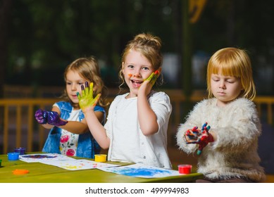 Children Having Fun Painting With Finger Paint