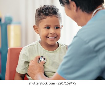 Children, Healthcare And Stethoscope With A Doctor Or Pediatrician Listening To The Heartbeat Of A Boy Patient In The Hospital. Nurse, Medical And Trust With A Male Child And Female Consultant