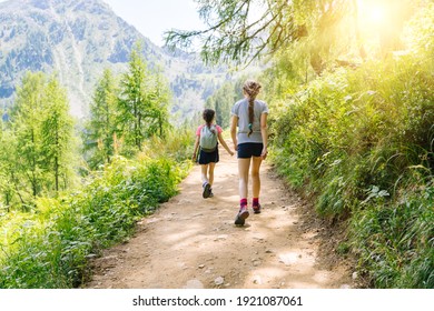 Children Hiking On Beautiful Summer Day In Alps Mountains Austria, Resting On Rock And Admire Amazing View To Mountain Peaks. Active Family Vacation Leisure With Kids.Outdoor Fun And Healthy Activity.