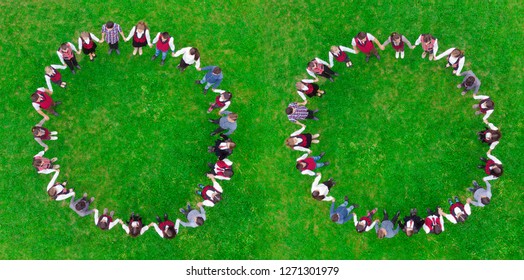 Children Holding Hands In Circle. Green Meadow Scene, Aerial View