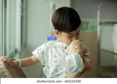 Children In Hospital, Recuperating With His Favorite Teddy Bear.