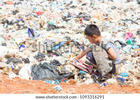 Children are junk to keep going to sell because of poverty, the concept of pollution and the environment,World Environment Day