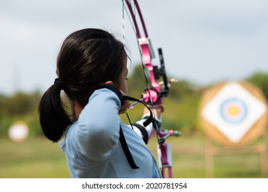 Children  learn compound bows in archery lessons.