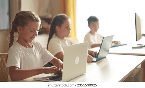 children learn from home through computers. business concept of modern training and development. group of little kids perform tasks in a laptop lifestyle at home schooling. educating from home - Powered by Shutterstock