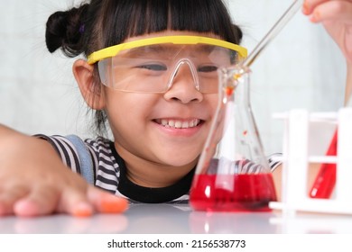 Children Are Learning And Doing Science Experiments In The Classroom. Little Girl Playing Science Experiment For Home Schooling. Easy And Fun Science Experiments For Kids At Home.