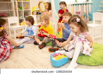 Children learning musical instruments on lesson in kindergarten or daycare