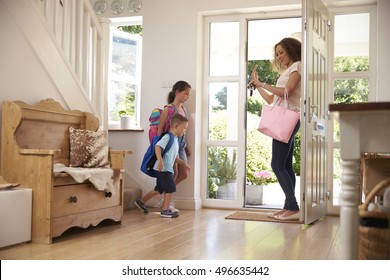 Children Leaving Home For School With Mother