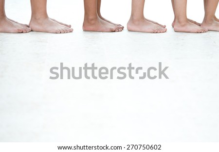 Similar – Unrecognizable diverse barefooted women in bath towels