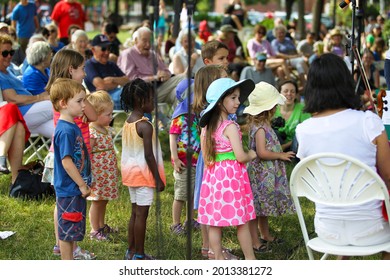 The Children Line Up On Stage To Learn How To Become A Conductor. Cambridge Symphony Orchestra Outdoor Perform At Sennott Park, Cambridge, MA On Sunday, June 29, 2014