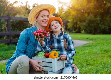 Children Little Girl Daughter Holds With Her Mother Basket Fresh Organic Vegetables Home Garden. Healthy Family Lifestyle, Care. Harvest Time Autumn. Family Farmers. Vegetarian, Raw Foods. Radish