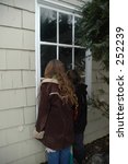 Children looking through window
