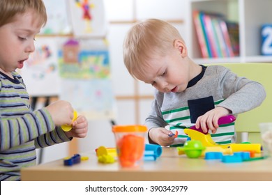 Children Modeling In Preschool Or Daycare Center