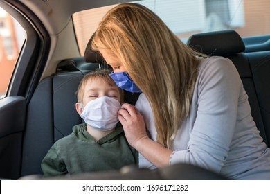 Children And Mom In Car Quarantine  At The Season Of The COVID-19 (corona-virus) With  Surgical Masks