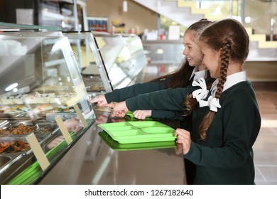 Children Near Serving Line With Healthy Food In School Canteen