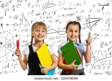 Children On The Background Of Formulas, Isolated On Wall Chalk Board Background. Childhood Children Kids Education Lifestyle Concept