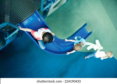 Children On Playground Equipment