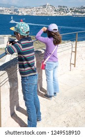 Children on the roof of Chateau d'If castle, Marseille, France. The Château d'If is a fortress famous for being one of the settings of Alexandre Dumas' adventure novel The Count of Monte Cristo.