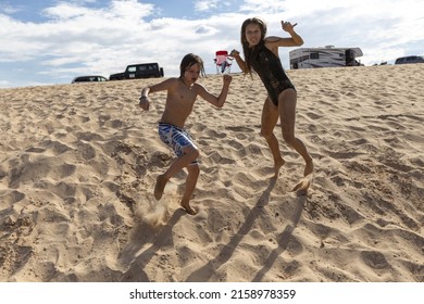 The Children On The Sandy Beach In Lake Powell, Arizona, USA