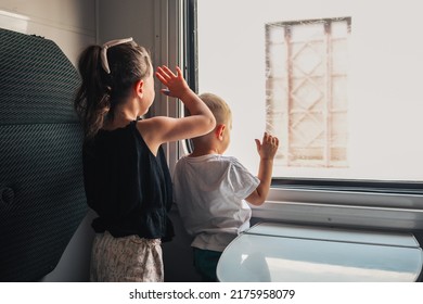 Children On The Train Wave Goodbye Through The Window.