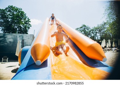 Children on water slide in aqua park