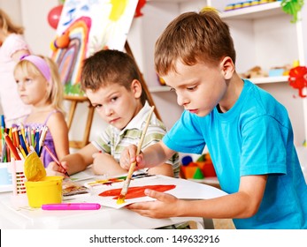 Children painting at easel in school. Education. - Shutterstock ID 149632916
