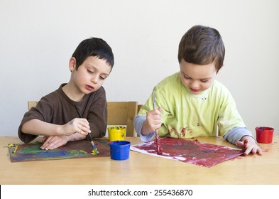 Children Painting A Picture With Brush At Home Or Playgroup.