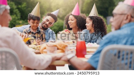 Children, parents and happy with hat at birthday party for celebration, laughing or memories in garden of home. Family, couple and kids with happiness for funny joke, gathering and event in backyard
