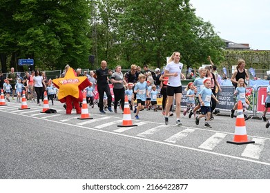 Children And Parents Running At A Children's Run Called 