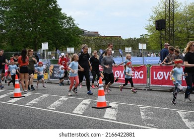 Children And Parents Running At A Children's Run Called 